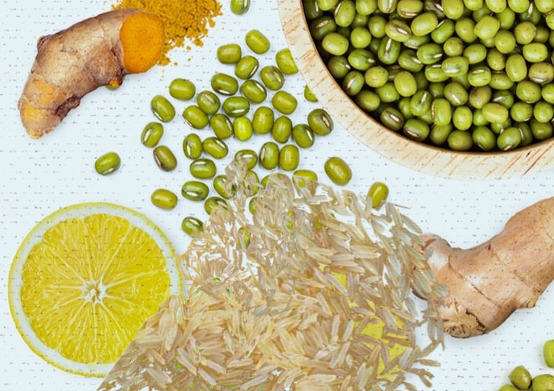 Khichari raw ingredients with whole green mung, Sona Masoori rice, ginger, turmeric and lemon
